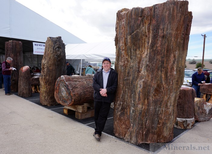 Posing in front of Giant Petrified Wood Logs, Between the Main and Showcase Tents